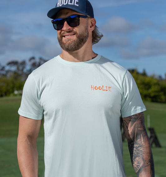 Men's 80's Vintage X Bones Golf T Shirt in Iceberg with orange Hoolie front logo and retro skull-and-drivers back design.