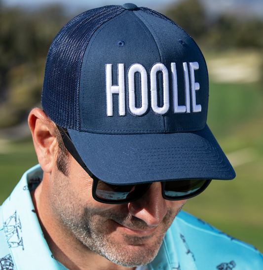 Men's Blue-White Hoolie Bold Golf Trucker Hat with white 3D HOOLIE logo embroidery, rope accent, and mesh back.
