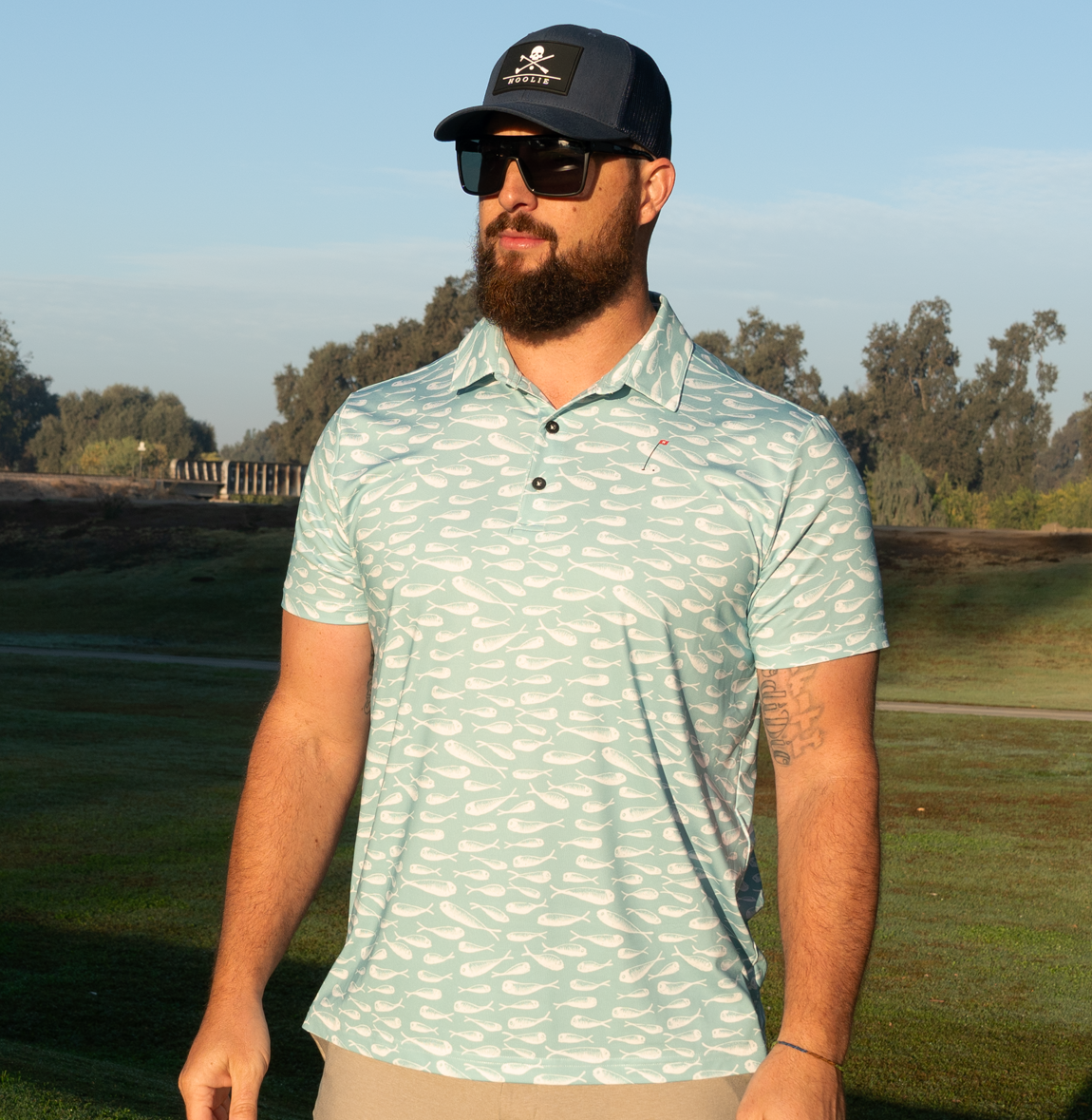 In the Drink Men's Golf Polo in Crystal Blue with white minnow pattern