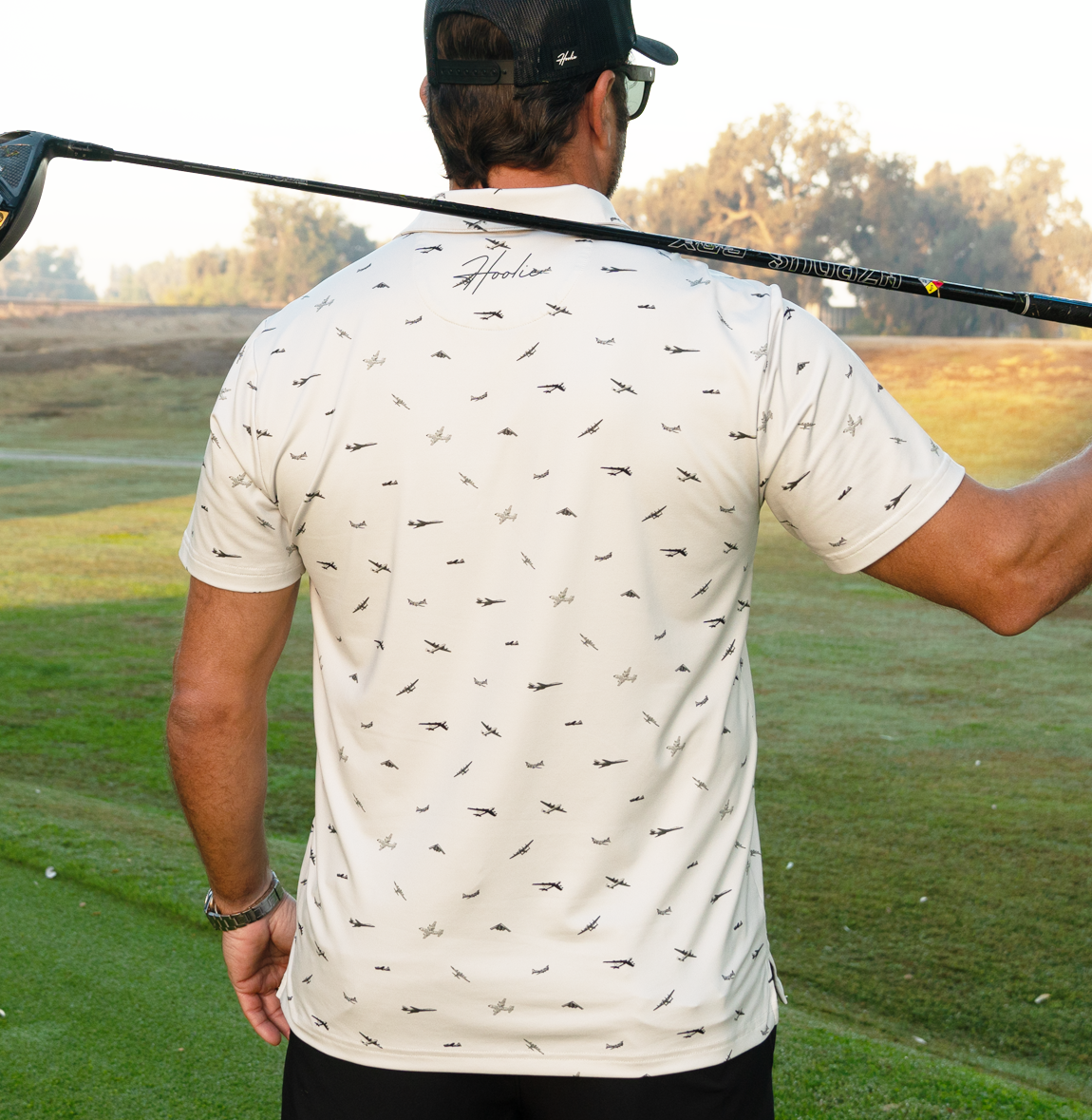 Performance Men's Golf Polo featuring bomber plane silhouettes by Hooli
