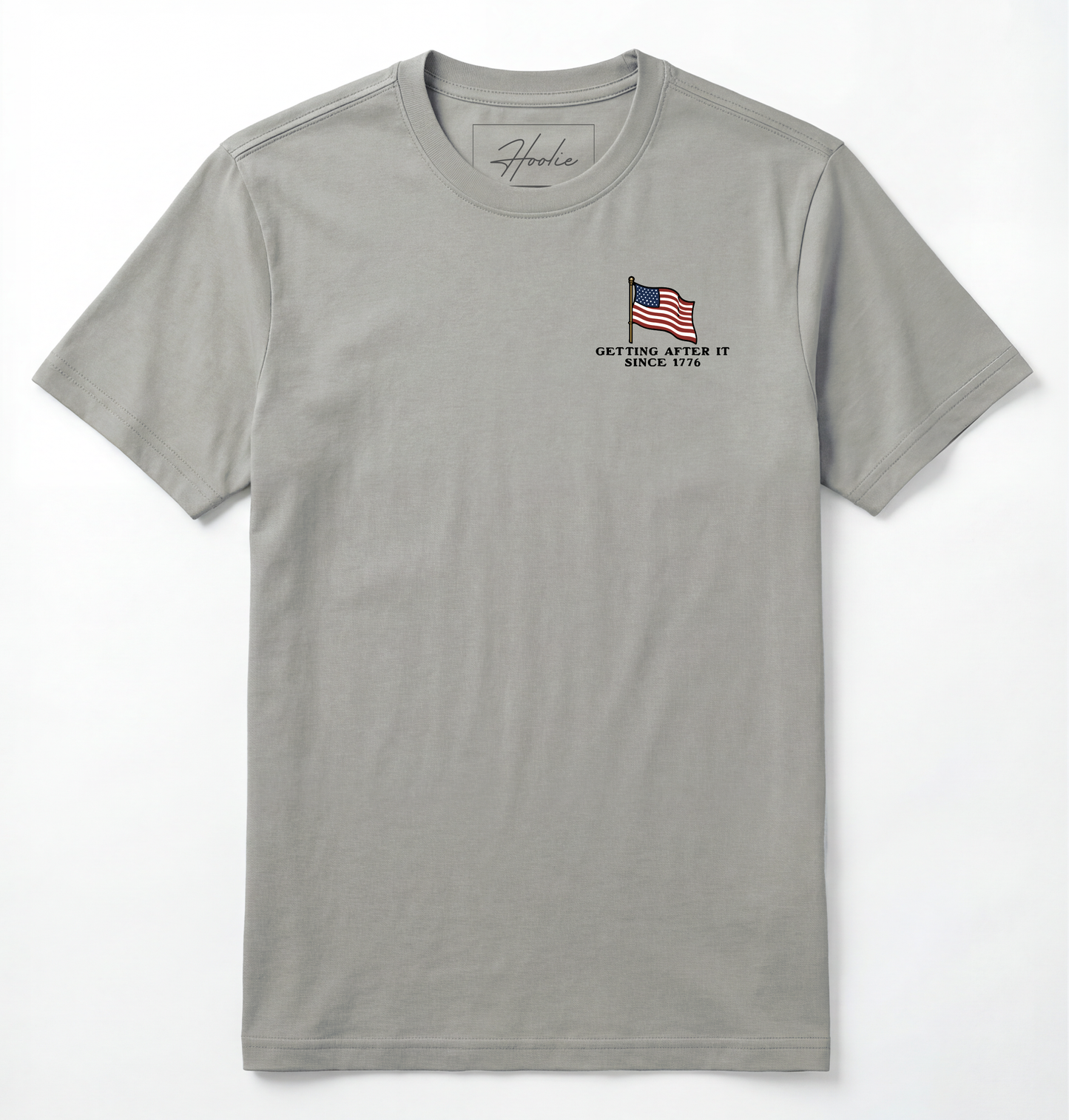 Front of Light gray T-shirt with American Flag that says Getting After it Since 1776