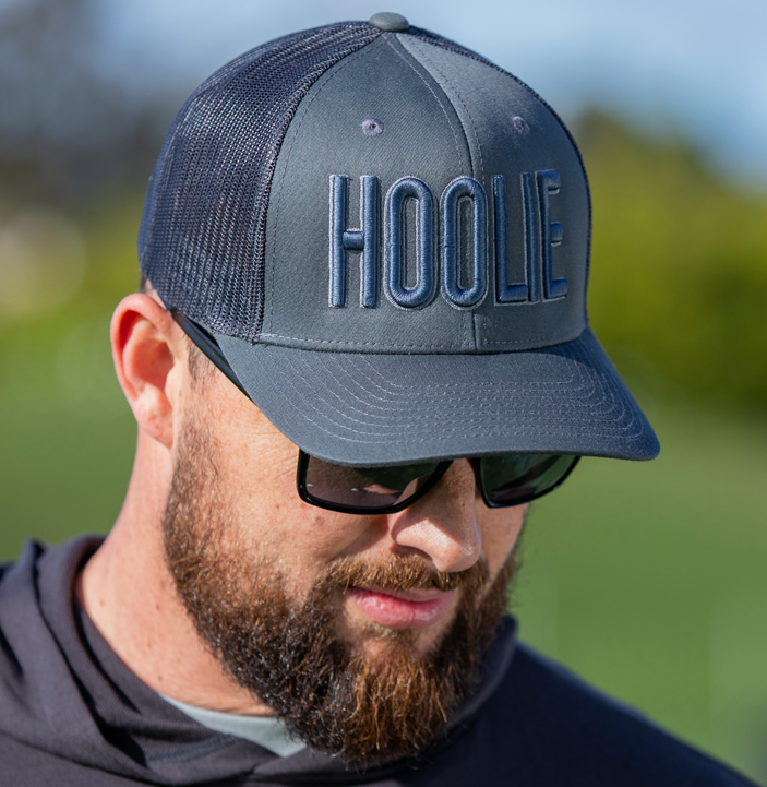 Men's Gray-Blue Hoolie Bold Golf Trucker Hat with blue 3D HOOLIE logo embroidery, rope accent, and mesh back.