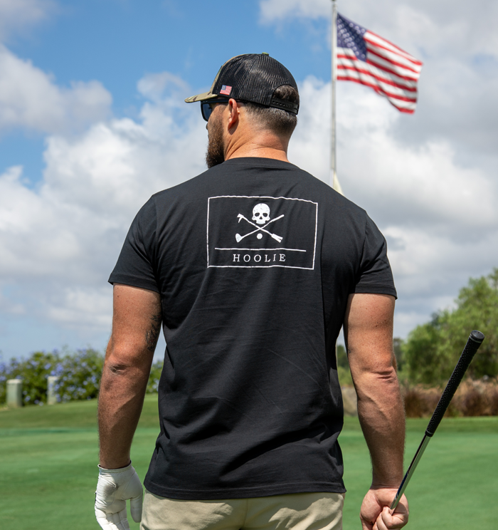 Golf T Shirt for Men with aged Jolly Roger skull design and Hoolie branding.