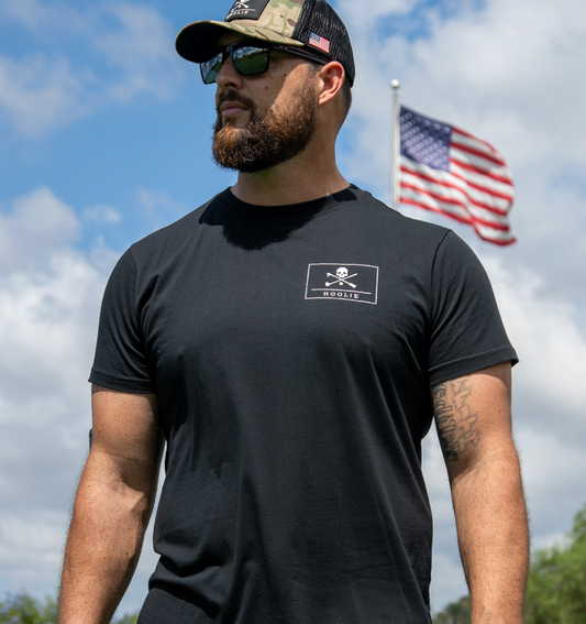 Men's Hoolie Roger Golf T Shirt in black with distressed white skull-and-crossbones pirate flag design.