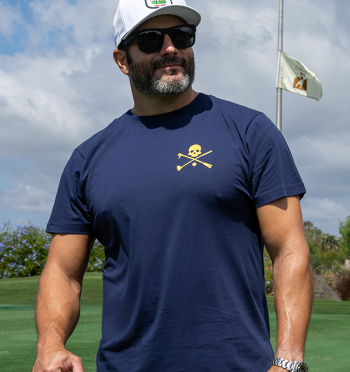 Men's Navy Hoolie's Creed Golf T Shirt with yellow creed back text and skull logo
