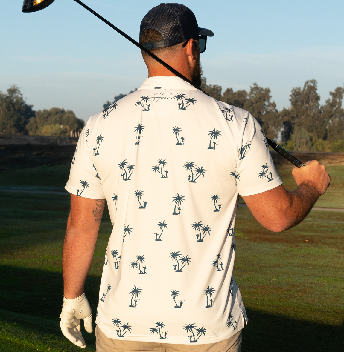 Palm-Ah Golf Polo in White with palm tree pattern and bodybuilder silhouettes