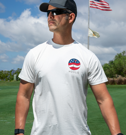 Men's RWB Flag Badge Golf T Shirt in patriotic red, white, and blue flag design.