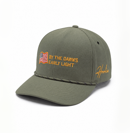 Quarter turn view of Olive Adjustable Hat with Rope Feature on Brim and Embroidered American Flag and Star Spangled Text on Front
