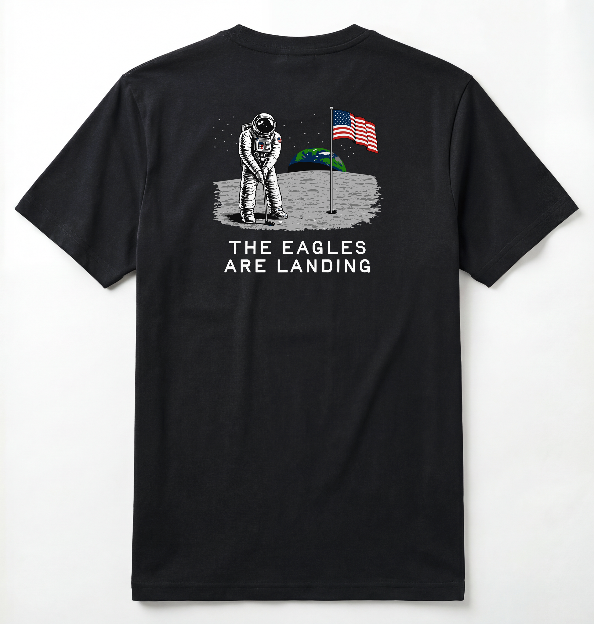 Back of Black T-shirt with astronaut putting a golf ball on the moon with earth seen behind him. Phrase on tee says The Eagles Are Landing.