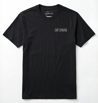 Front of Black T-shirt with phrase that says The Eagles Are Landing.