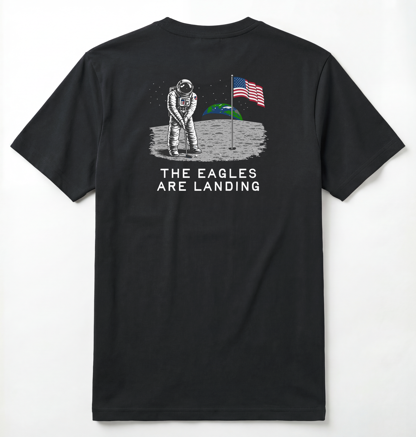 Back of Black T-shirt with astronaut putting a golf ball on the moon with earth seen behind him. Phrase on tee says The Eagles Are Landing.
