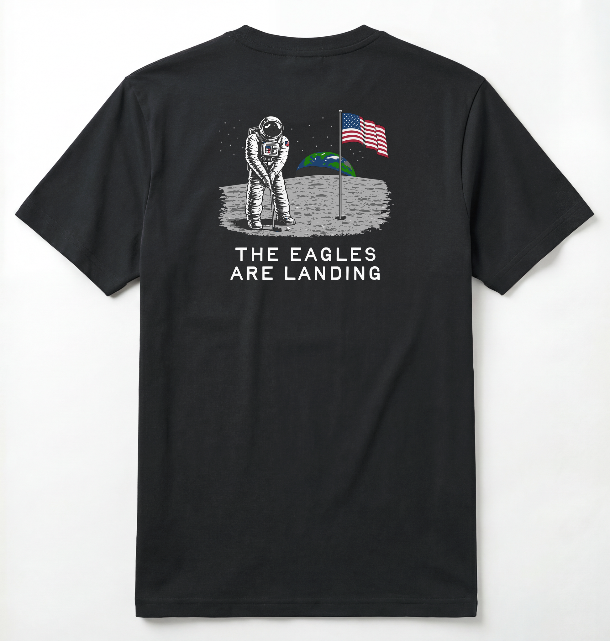 Back of Black T-shirt with astronaut putting a golf ball on the moon with earth seen behind him. Phrase on tee says The Eagles Are Landing.