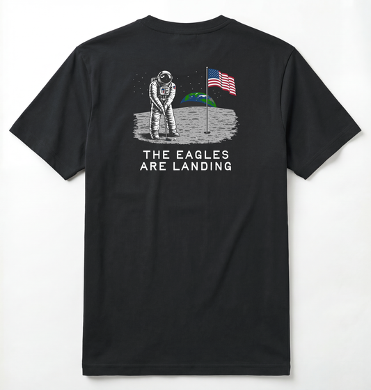 Back of Black T-shirt with astronaut putting a golf ball on the moon with earth seen behind him. Phrase on tee says The Eagles Are Landing.