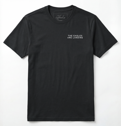 Front of Black T-shirt with phrase that says The Eagles Are Landing.