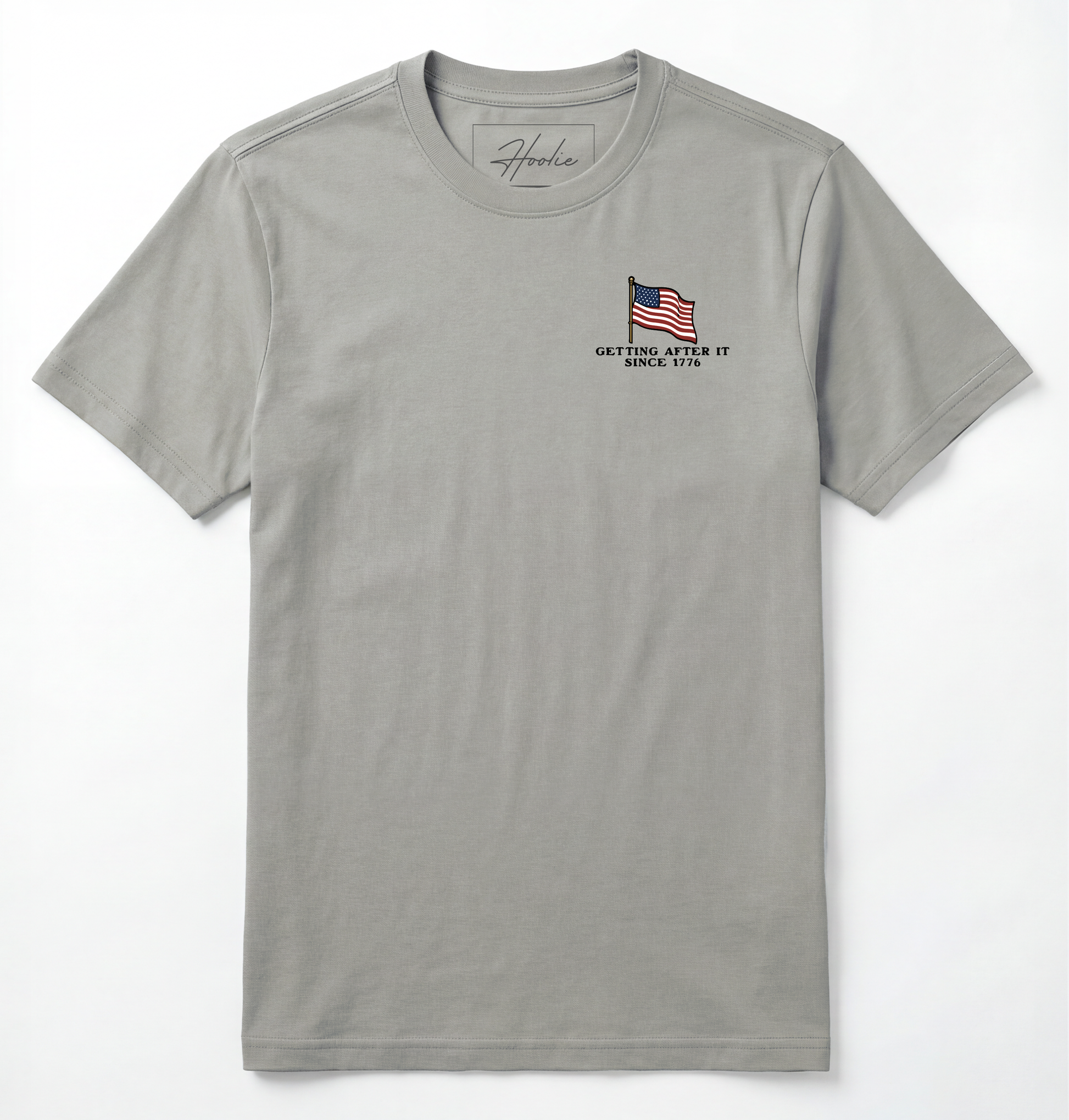 Front of Light gray T-shirt with American Flag that says Getting After it Since 1776