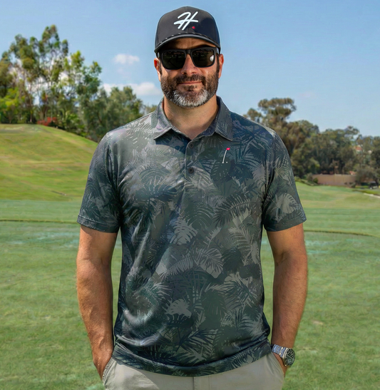 Man wearing Men's Performance Golf Polo with Various Shades of Gray and Green Jungle Palm Fronds