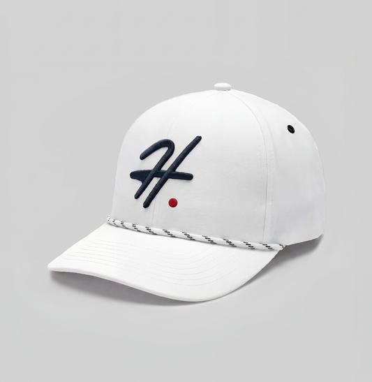White cap with a blue H logo and a red dot on a white background